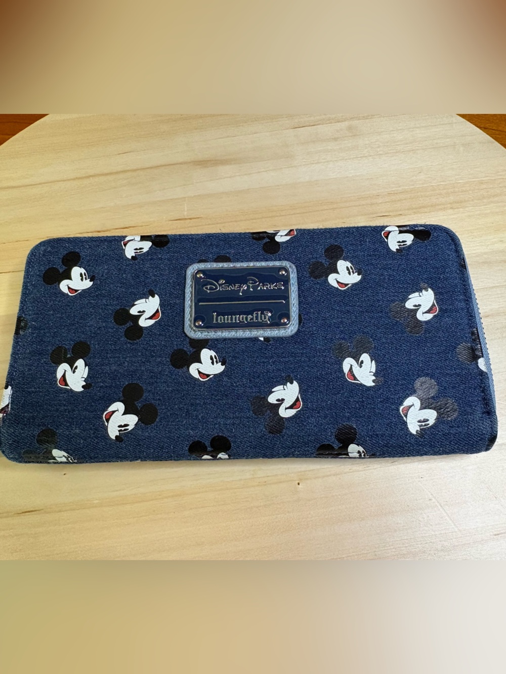 The Disney Parks Loungefly Mickey Mouse Denim zip around wallet, like new